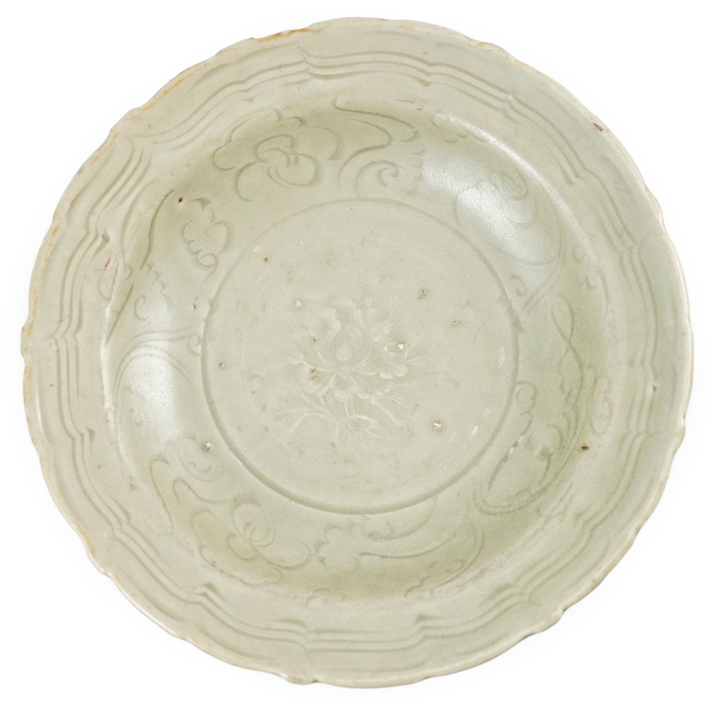 A Chinese Longquan celadon barbed rim dish, Yuan-early Ming dynasty, 14th/15th century, 22.5cm diameter